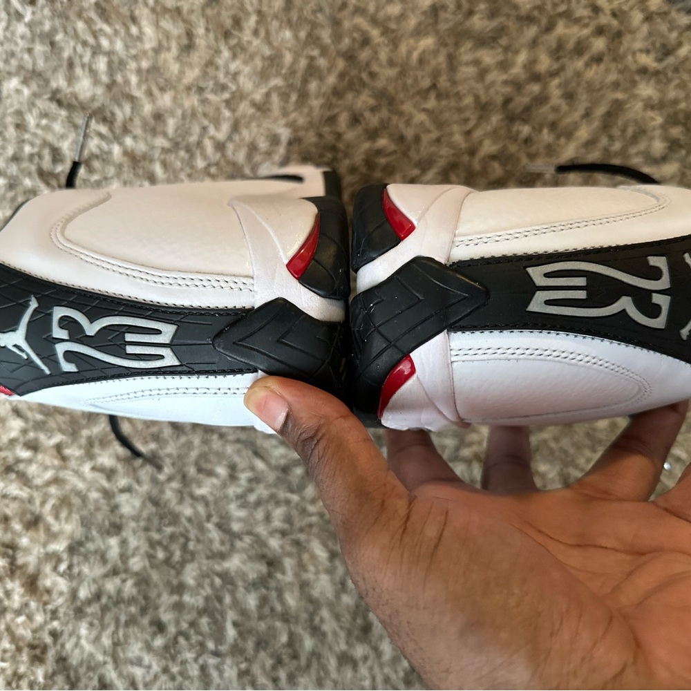 White and Black Sneakers with Red Accents